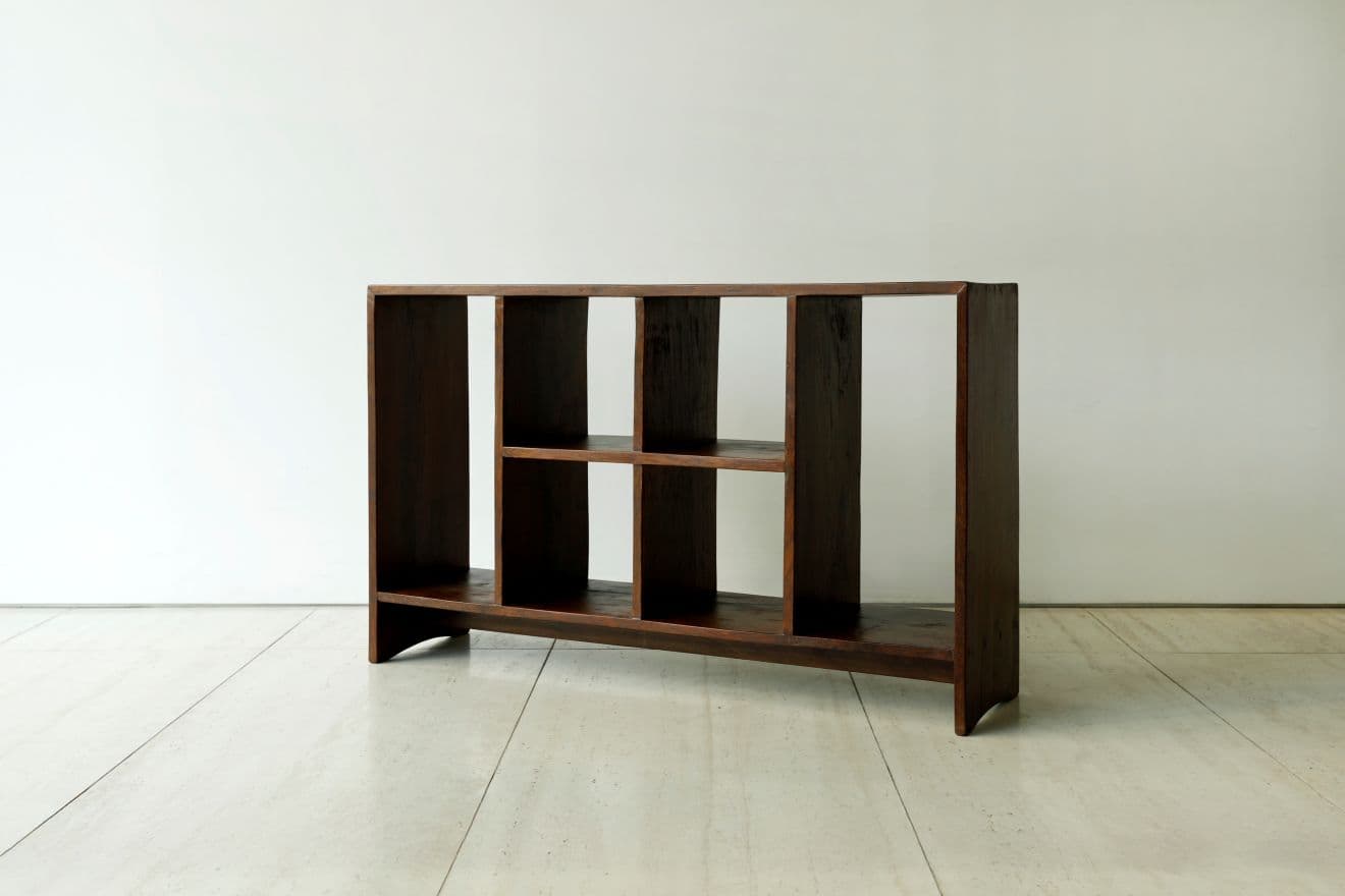 A dark brown wooden shelving unit with multiple open compartments, featuring a solid construction and varying shelf configurations. — 3D model