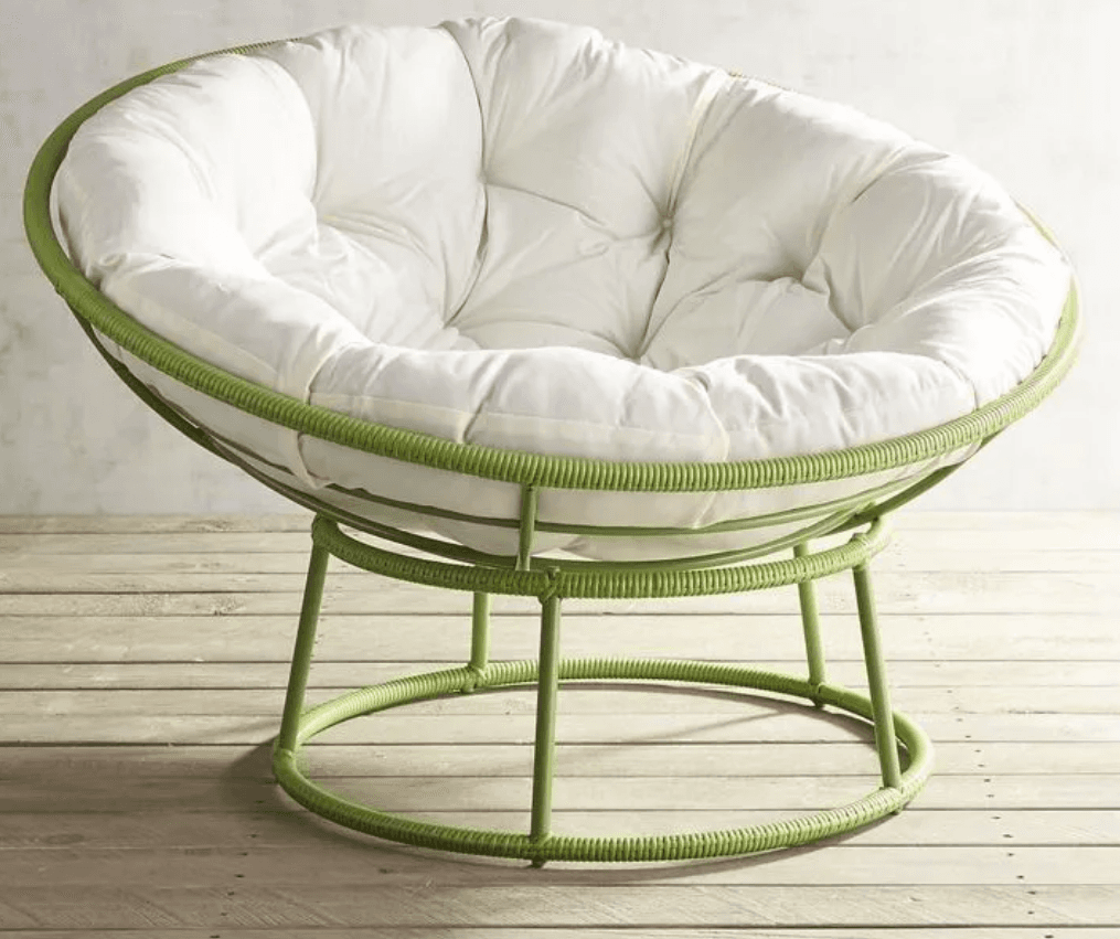 A contemporary papasan-style lounge chair featuring a circular green frame and a large, plush, tufted white cushion. The frame appears to be made of metal, possibly wrapped with a green cord or rattan-like material, creating a distinctive texture. The cushion is deeply tufted, providing a comfortable and inviting seating surface. The chair rests on a stable, low-profile base, also constructed from the same green material. — 3D model