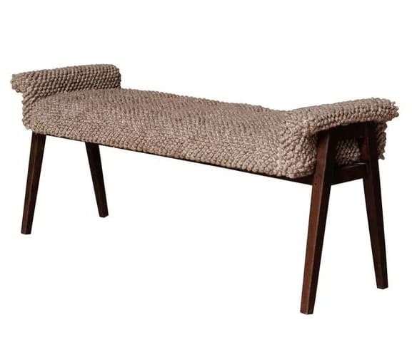 A long, rectangular contemporary bench featuring a highly textured, light brown or beige upholstery with a distinct bobble or knobby pattern. The bench is supported by four dark, tapered wooden legs that splay slightly outwards. The ends of the seat are gently rolled upwards, adding a subtle design detail. — 3D model