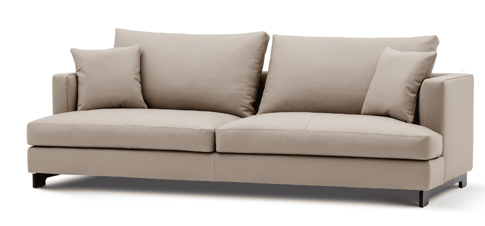 A modern two or three-seater sofa upholstered in a light beige, smooth fabric or faux leather, featuring clean, minimalist lines. It has two large, loose seat cushions and two equally large, loose back cushions, along with two smaller square throw pillows. The arms are track-style, and the sofa is elevated by low-profile, dark-colored rectangular metal legs, giving it a light, floating appearance. Stitching detail is visible along the edges of the cushions and frame. — 3D model