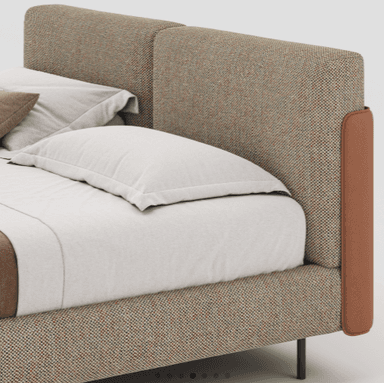 A modern upholstered bed frame with a horizontally segmented headboard. The bed is dressed with linens including a fitted sheet, duvet, and accent pillows. The frame is supported by slim, dark-colored legs. A small side table with books is visible to the left. — 3D model