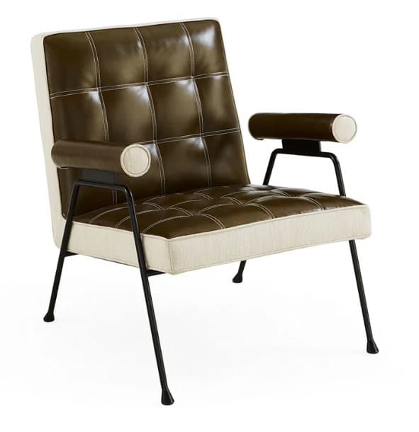 A modern armchair with a low profile and exposed metal frame. The seat and backrest are upholstered in a tufted brown material, likely leather or faux leather, with contrasting white stitching. The sides and front base of the seat cushion are upholstered in a textured cream fabric. The armrests are cylindrical and upholstered in the same brown material as the seat and back, with cream fabric caps. The chair is supported by slender, tapered black metal legs. — 3D model