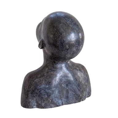 A dark-toned, stylized bust sculpture depicting a human head and partial upper torso, with the head tilted upwards and the gaze directed skyward. The material appears to be a dark stone with subtle veining and a matte finish. — 3D model