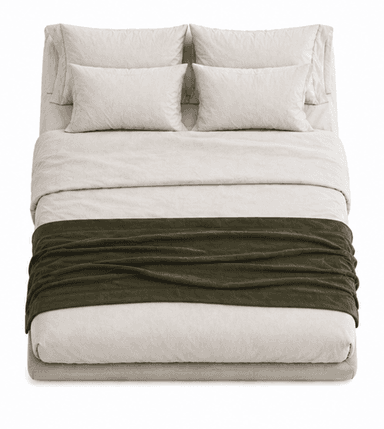 A low-profile upholstered bed frame with a headboard composed of three pillows and bedding. A folded blanket is draped across the foot of the bed. — 3D model
