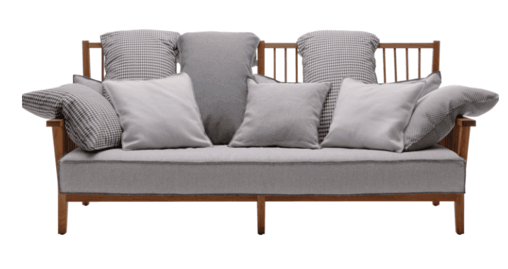 A contemporary loveseat featuring an exposed wooden frame with a slatted backrest. It includes a single, light gray upholstered seat cushion and an assortment of loose back and accent cushions. Some cushions are solid light gray, while others feature a black and white houndstooth pattern, providing a contrasting textural element. The wooden frame has a natural or light brown finish, complementing the neutral fabric tones. — 3D model
