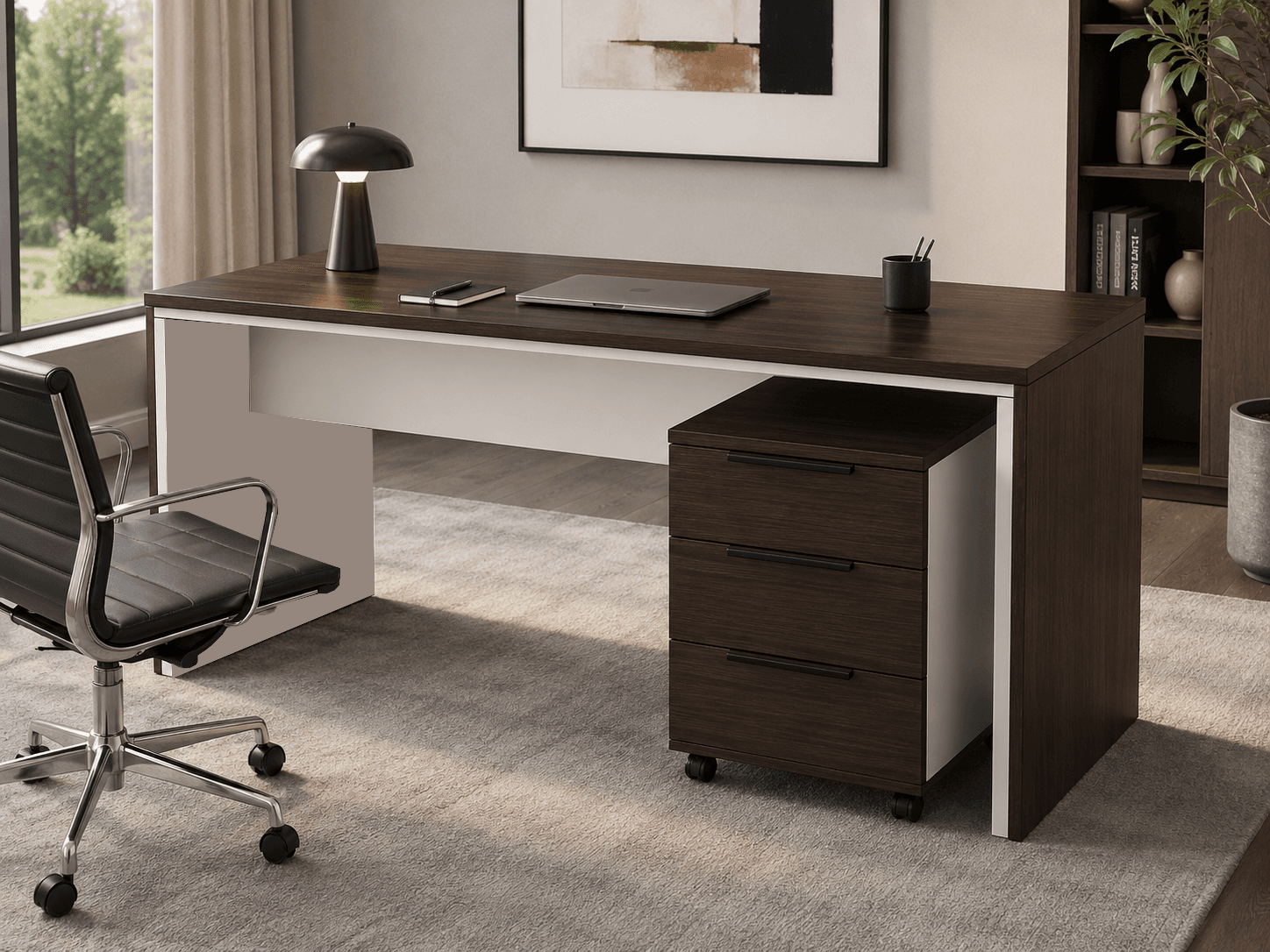 A modern rectangular office desk featuring a dark brown wood-grain finish top and side panel, contrasted with a white frame. The desk includes a mobile three-drawer pedestal unit with black handles, also in a dark brown finish. An office chair, a table lamp, and various office accessories are also visible, suggesting a functional workspace. — 3D model