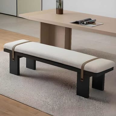 A contemporary upholstered bench featuring a dark, solid rectangular base and a light-colored, plush cushion. A contrasting strap, possibly leather or faux leather, secures the cushion to the base, adding a functional and decorative element to its minimalist design. — 3D model