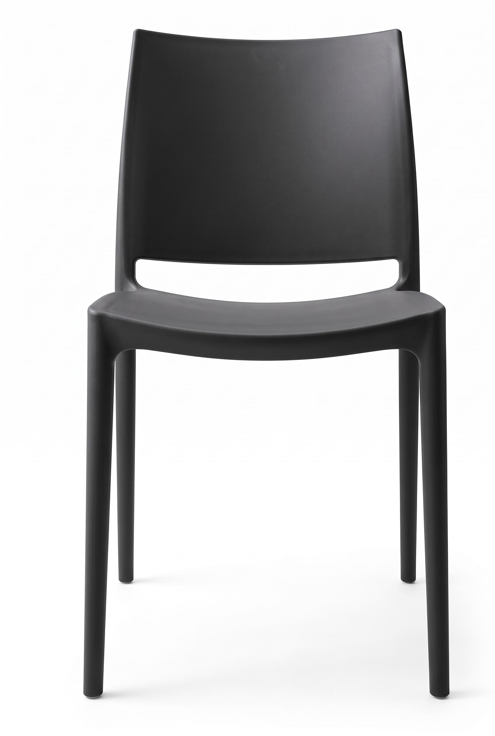 A contemporary armless side chair crafted from a single piece of molded black plastic, featuring a minimalist design. The chair has a curved backrest for ergonomic comfort and a subtle horizontal cutout at the lower back. The surface has a matte, finely textured finish, and the four integrated legs are sturdy and cylindrical. — 3D model