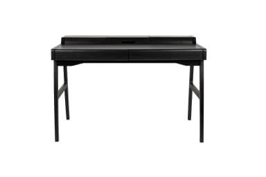 A black wooden desk with a minimalist design. It features a rectangular top with two raised compartments at the back, suggesting potential integrated storage or cable management. The desk has two drawers integrated into the front apron. It is supported by four angled legs connected by a crossbar for stability. The overall aesthetic is modern and clean. — 3D model