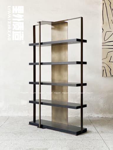 A tall, rectangular modern shelving unit featuring dark-stained wooden shelves and a minimalist dark metal frame. A contrasting vertical brass-toned rod runs down the front, and a wider brass-toned panel forms the central back support, providing a decorative element and structural stability. The design is open-backed, emphasizing clean lines and a contemporary aesthetic. — 3D model