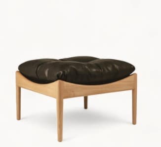 A modern ottoman featuring a light-colored wooden frame and a plush, button-tufted black leather cushion. The frame has straight, slightly splayed legs, and the cushion is deeply upholstered, suggesting comfort. — 3D model