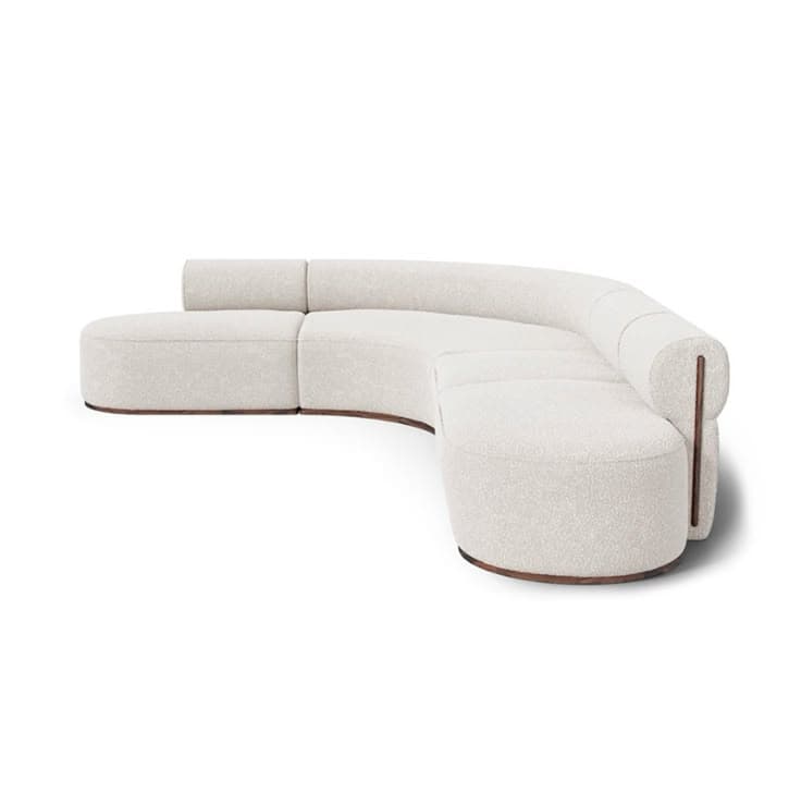 A contemporary, off-white, curved sectional sofa featuring soft boucle upholstery and a dark wooden plinth base, designed for modular arrangement. — 3D model