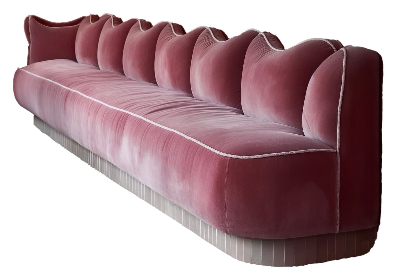 A long, plush sofa with a distinctive wave-like backrest design. The upholstery appears to be velvet, in a rich pink or rose hue. A contrasting white piping runs along the edges of the seat and back cushions, accentuating the curved forms. The base of the sofa is a lighter, muted tone with a ribbed texture, giving it a modern yet elegant appearance. — 3D model