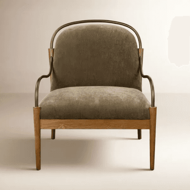 A contemporary upholstered accent armchair featuring a light oak wooden frame and distinctive curved metal arms in a bronze or brass finish. The seat and backrest are generously cushioned and upholstered in an olive green or khaki fabric. The chair stands on four tapered wooden legs, and the overall design is clean and modern. — 3D model