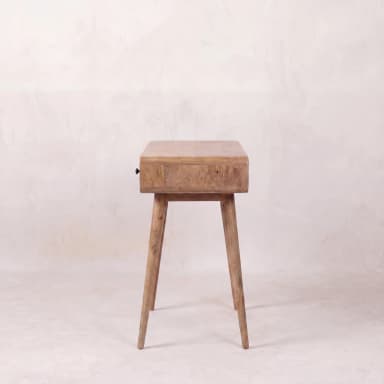 A mid-century style console table crafted from solid wood with a natural finish. It features a main body with softly rounded edges, containing one open rectangular compartment and one pull-out drawer with a circular black knob. The table stands on four slender, tapered, and slightly splayed legs. — 3D model