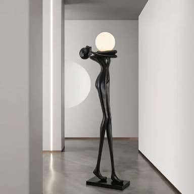 A contemporary floor lamp featuring a sculptural, stylized humanoid figure in black, holding a spherical white light diffuser. The slender figure stands on a flat, rectangular base. — 3D model