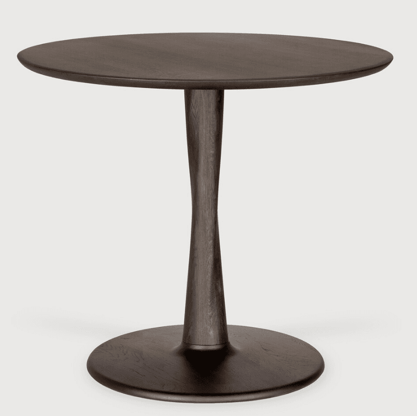 A round table with a dark wood finish, featuring a distinctive hourglass-shaped pedestal base and a round top with a slightly beveled edge. The entire piece is monochromatic dark brown, almost black. — 3D model
