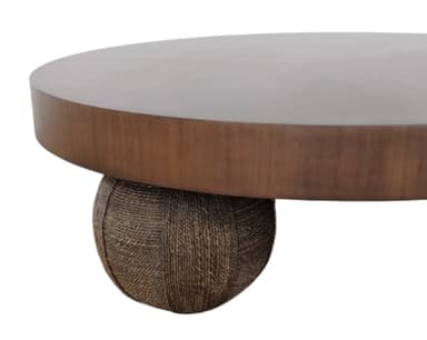 A contemporary low-profile coffee table featuring a circular dark wood top and three textured, spherical dark brown legs. The design is minimalist and organic, emphasizing the distinct leg structure. — 3D model
