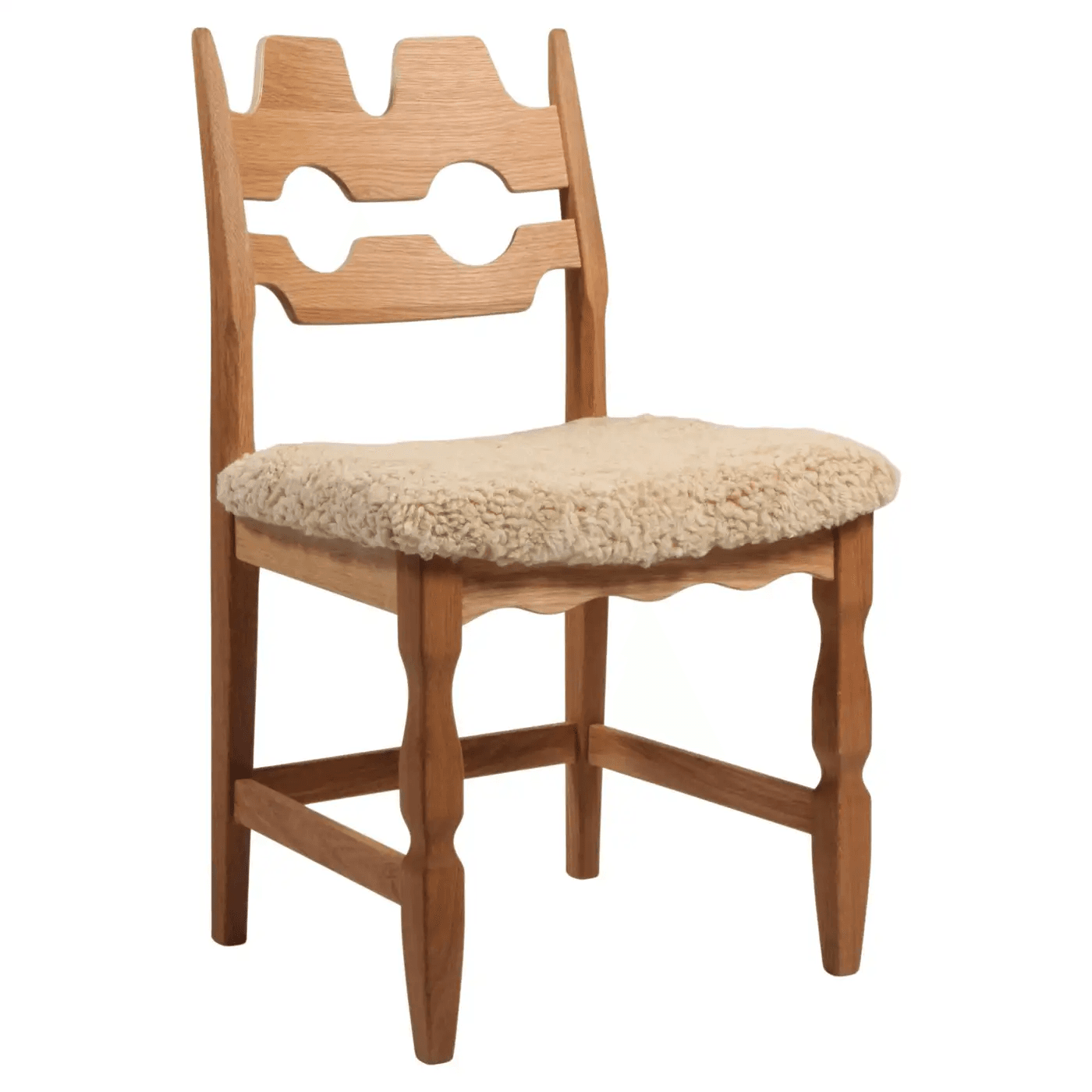 A light-colored wooden side chair featuring a distinctive carved backrest with cutout designs and a thick, shaggy upholstered seat. — 3D model