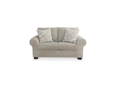 A light greige upholstered loveseat, viewed from the rear-side, featuring rolled arms and two plush back cushions, supported by low-profile dark feet. — 3D model