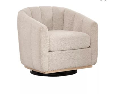 A swivel armchair with a rounded, barrel-shaped back and arms. The upholstery features a textured, plush fabric resembling sherpa or boucle, with vertical channel tufting on the exterior of the back and sides. The chair sits on a dark-colored swivel base, topped with a light-colored wooden accent ring. — 3D model