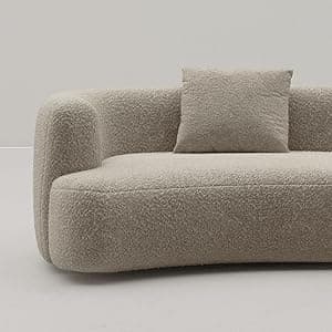 A large, modular, curved sofa with a textured, boucle-like upholstery. The sofa features rounded edges and appears to be composed of at least two connected sections, forming a sweeping arc. It includes two square throw pillows that match the sofa's upholstery. The design is contemporary with a soft, inviting aesthetic. — 3D model