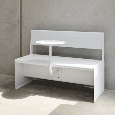 A modern, white bench with a built-in backrest and a small, round side table attached to a curved support arm. The bench has a clean, minimalist design with straight lines and a solid construction, suitable for public spaces or contemporary interiors. — 3D model