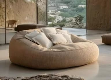 An oversized, amorphous bean bag chair upholstered in a textured beige fabric, accompanied by a cluster of smaller, off-white accent pillows. — 3D model