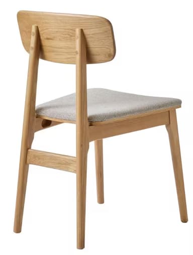 A contemporary dining chair featuring a solid oak wood frame with a clear, light-brown finish and a subtly curved wooden backrest. The seat is upholstered in a light beige, textured fabric. The chair stands on four sturdy, tapered wooden legs, with visible wood grain throughout the frame, suggesting a natural and minimalist design. — 3D model