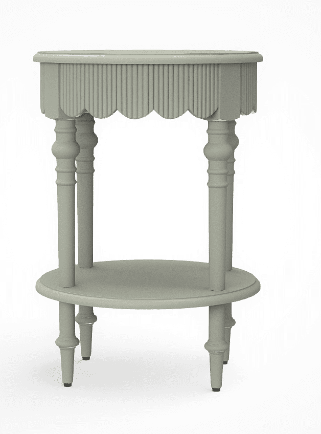 A light sage green, two-tiered accent table featuring a distinctive scalloped and reeded apron around the upper tabletop. The table is supported by four elegantly turned spindle legs, which also provide support for a circular lower shelf. The feet are simple and finished with small black glides. The overall design suggests a blend of traditional and cottage aesthetics. — 3D model