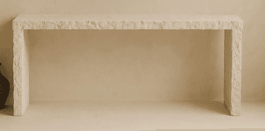 A rectangular console table with a thick, solid top and two substantial legs that appear to be integrated into the tabletop, forming a U-shape. The surface exhibits a textured, natural stone appearance. — 3D model