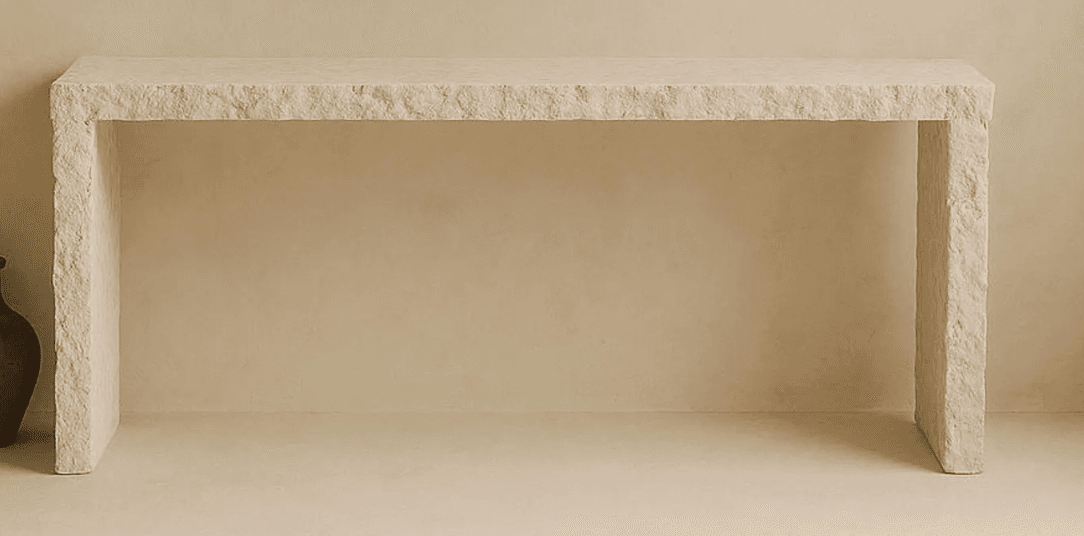 A rectangular console table with a thick, solid top and two substantial legs that appear to be integrated into the tabletop, forming a U-shape. The surface exhibits a textured, natural stone appearance. — 3D model