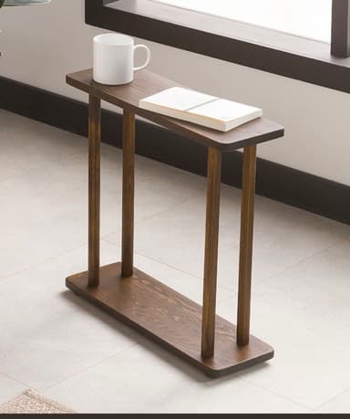 A minimalist console table crafted from dark-stained wood, featuring a narrow rectangular top, a matching base, and four slender cylindrical legs connecting the two planes. — 3D model