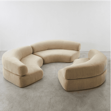 A large, modular sectional sofa with multiple curved sections, upholstered in a light beige velvet fabric, designed for flexible arrangement in a contemporary setting. — 3D model