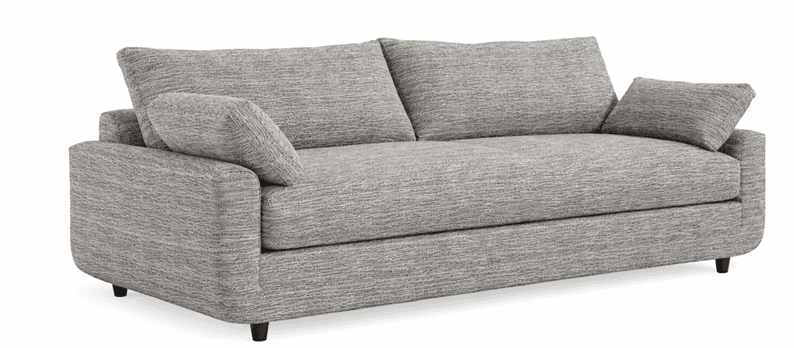 A contemporary three-seater sofa with a plush, textured fabric upholstery. It features wide, rolled arms, deep seat cushions, and multiple back pillows. The sofa sits on short, dark, tapered wooden legs. — 3D model