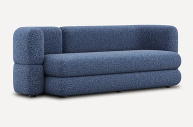A low-profile, modular sofa with rounded edges and a textured fabric upholstery. The sofa appears to be constructed from densely packed foam or similar cushioning material. It features a distinct layered design for both the seat and backrest. Small, dark cylindrical legs support the base. — 3D model