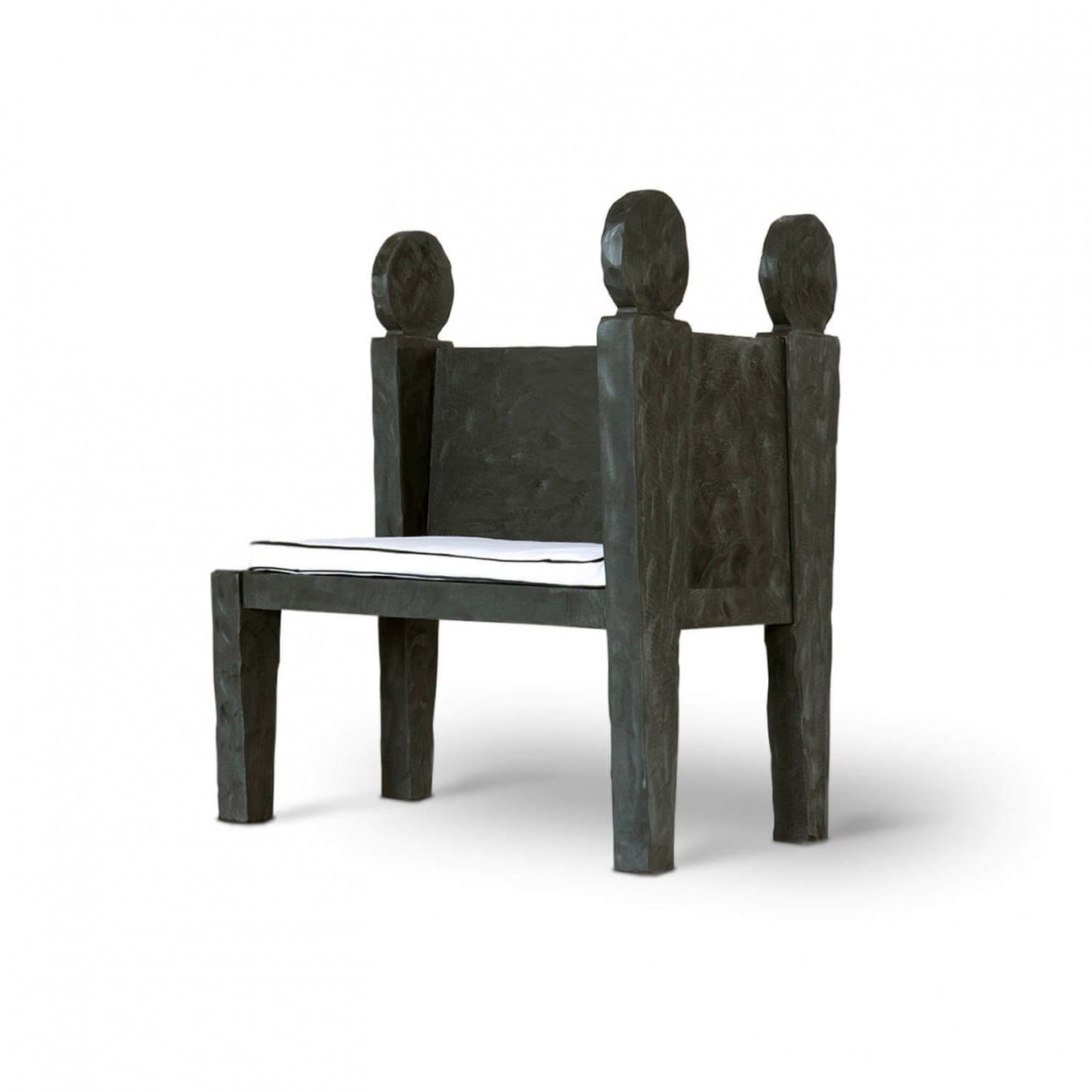 A high-backed armchair characterized by its robust, block-like construction and dark, roughly textured wood. The chair features broad, integrated armrests and a tall backrest topped with three distinct, carved finials. A simple, thin white seat cushion with a black piped edge provides seating contrast. — 3D model
