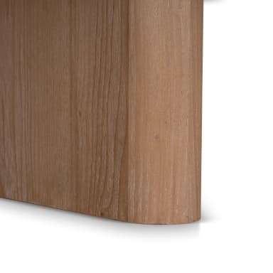 A round coffee table with a thick, light-colored stone top and a solid wooden base. The base features a cross-shaped pedestal with curved, rectangular supports that connect to the underside of the tabletop. — 3D model