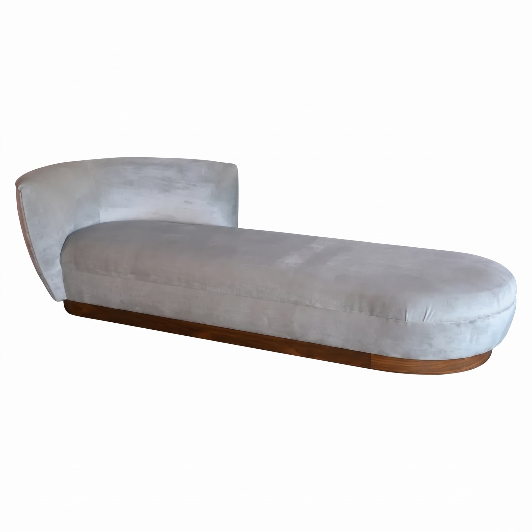 An elegant, modern chaise lounge featuring a light grey velvet upholstery and a curved backrest, supported by a distinct solid wood plinth base. — 3D model
