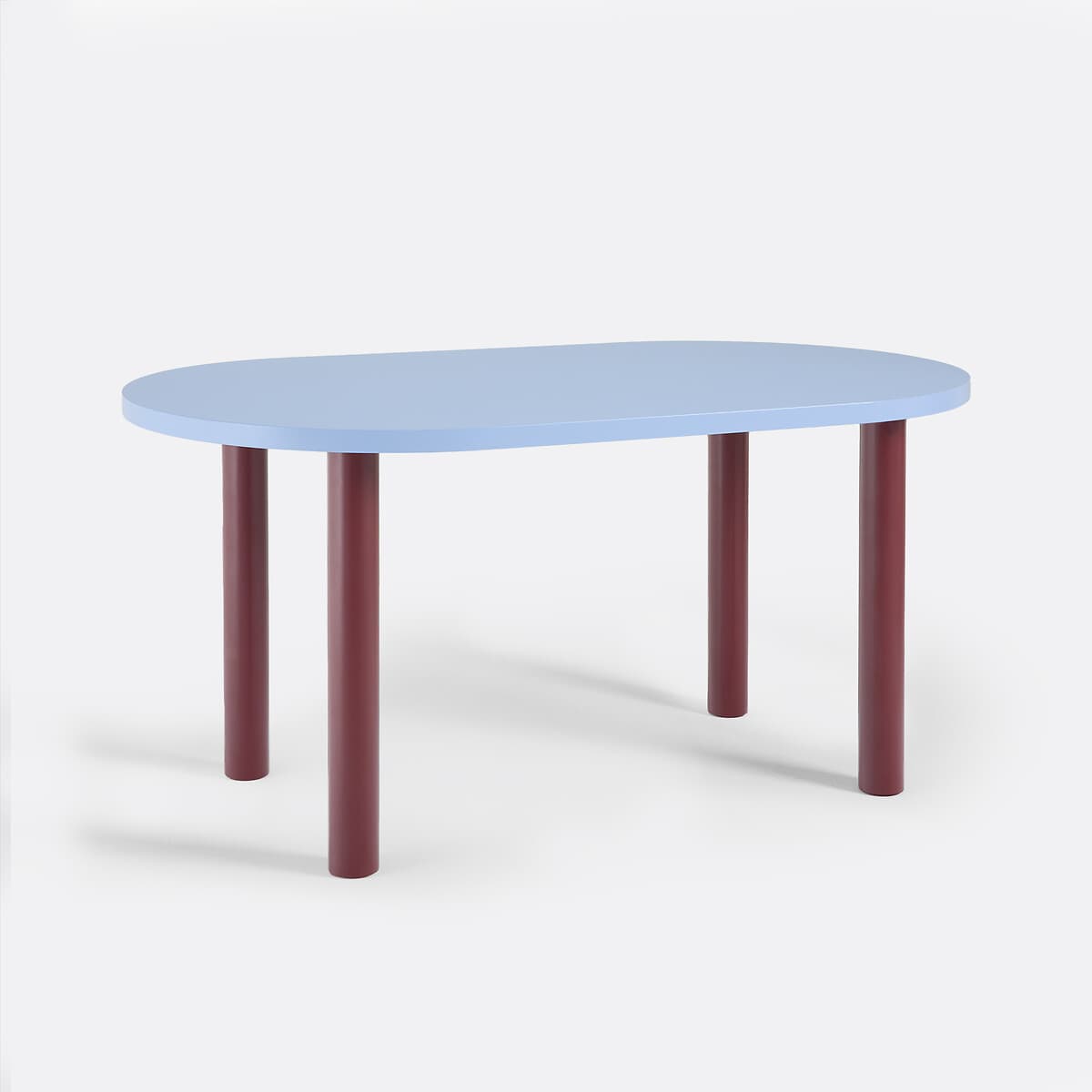 A contemporary oval table featuring a light blue tabletop and four sturdy, cylindrical maroon legs, designed with a minimalist aesthetic and a striking color contrast. — 3D model