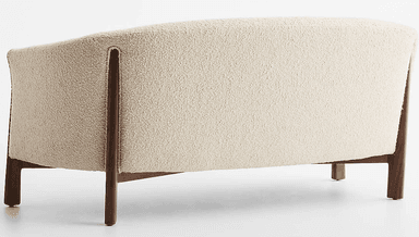 A two-seater loveseat featuring a curved back and integrated armrests, upholstered in a light-colored, textured boucle fabric. It is supported by a visible dark wood frame that extends from the base to form the armrests and partially the back structure. The loveseat rests on four short, solid wooden legs. — 3D model