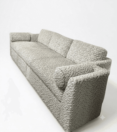 A contemporary three-seater sofa upholstered in a light, neutral-toned, richly textured fabric. It features three loose back cushions, wide integrated armrests, and two cylindrical bolster pillows at each end. The sofa has a low-profile design with a deep, continuous seat cushion. — 3D model