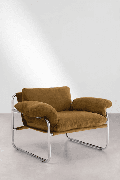 A modern lounge armchair featuring a polished tubular chrome frame and plush, warm brown upholstered cushions. The design evokes a Bauhaus aesthetic with its minimalist frame and deep, comfortable seating. — 3D model