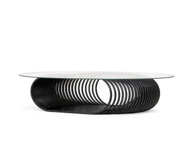 An oval-shaped coffee table featuring a clear glass top supported by a distinctive sculptural base made of numerous dark, parallel wooden slats arranged in an elliptical, coiled pattern. The base rests on a matching dark wooden plinth. — 3D model