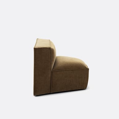 A modular armchair with a low profile and a geometric design. The upholstery features a corduroy-like texture with vertical ribbing. The seat is a rounded pentagonal shape, and the backrest is straight and slightly curved to form a corner unit. The frame appears to be upholstered, with visible piping along the seams. — 3D model