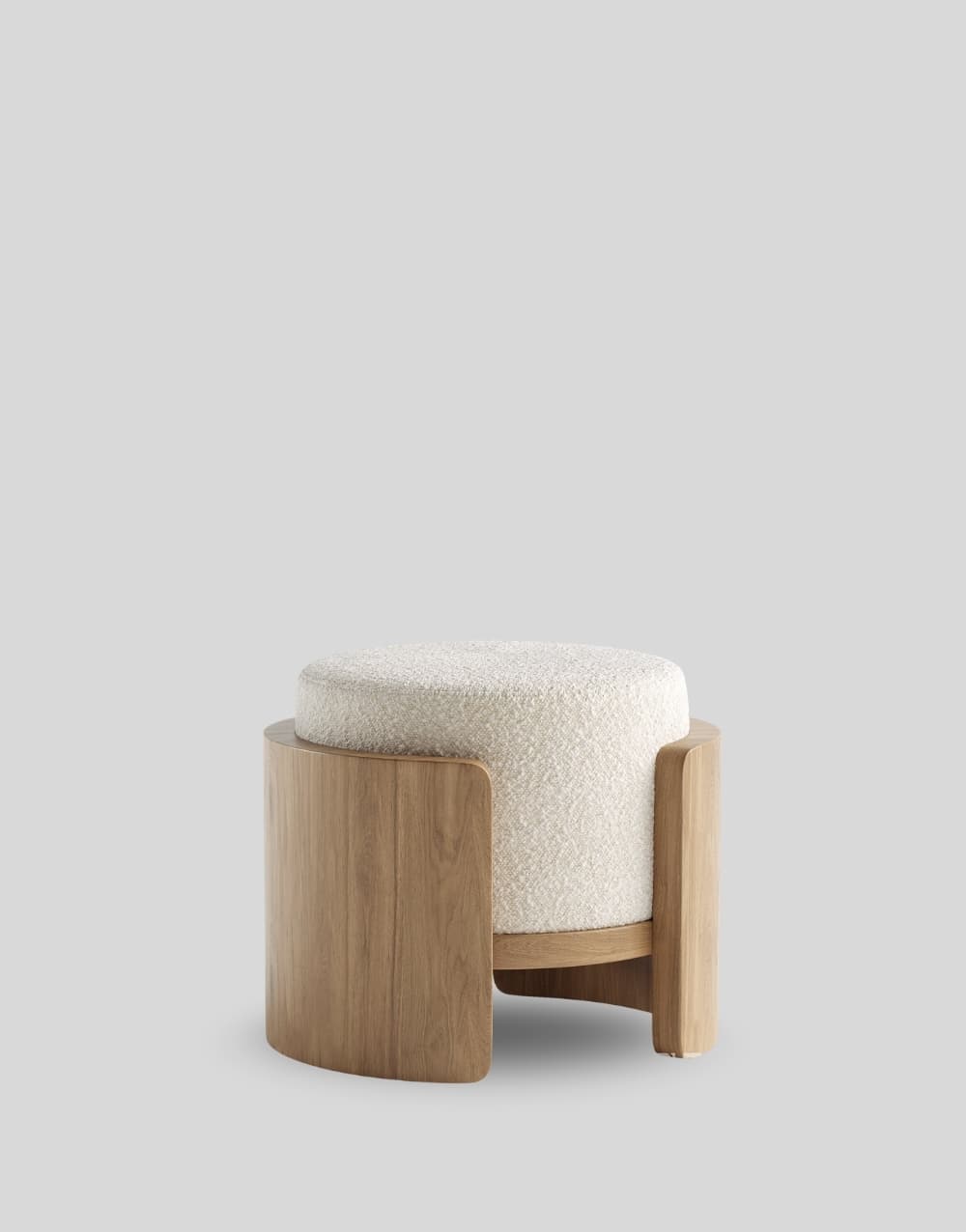A modern, round ottoman featuring a cream-colored boucle upholstered cushion cradled within a distinctive curved light wood frame. — 3D model