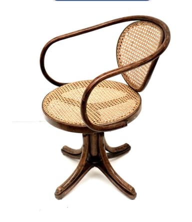 A vintage bentwood swivel desk chair featuring a dark wood frame, woven cane seat, and a curved backrest. — 3D model