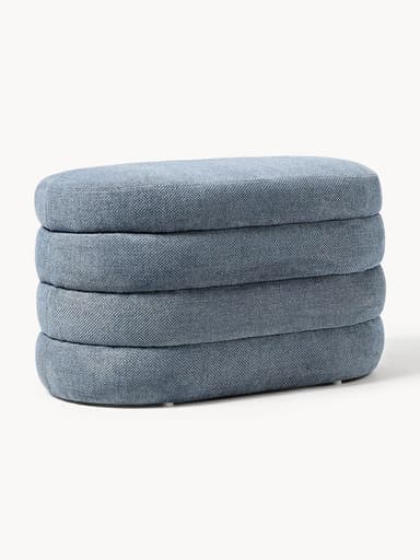 A stack of four upholstered ottomans, each with a rounded rectangular shape and a textile covering. The ottomans appear to be designed for stacking or as individual seating units. — 3D model
