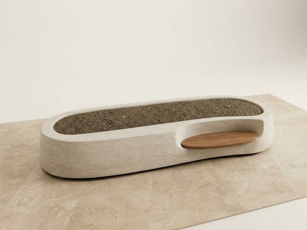An elongated, oval-shaped planter bench made from light-colored concrete or a similar composite material, featuring a central trough for plants and an integrated oval wooden seat on one side. The design is modern and minimalist. — 3D model