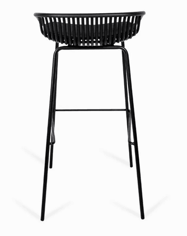 A contemporary bar stool featuring a black powder-coated metal wireframe bucket seat and backrest, paired with a fitted black padded seat cushion. The stool stands on four slender, tapered metal legs with integrated footrests, all finished in a matching matte black. — 3D model
